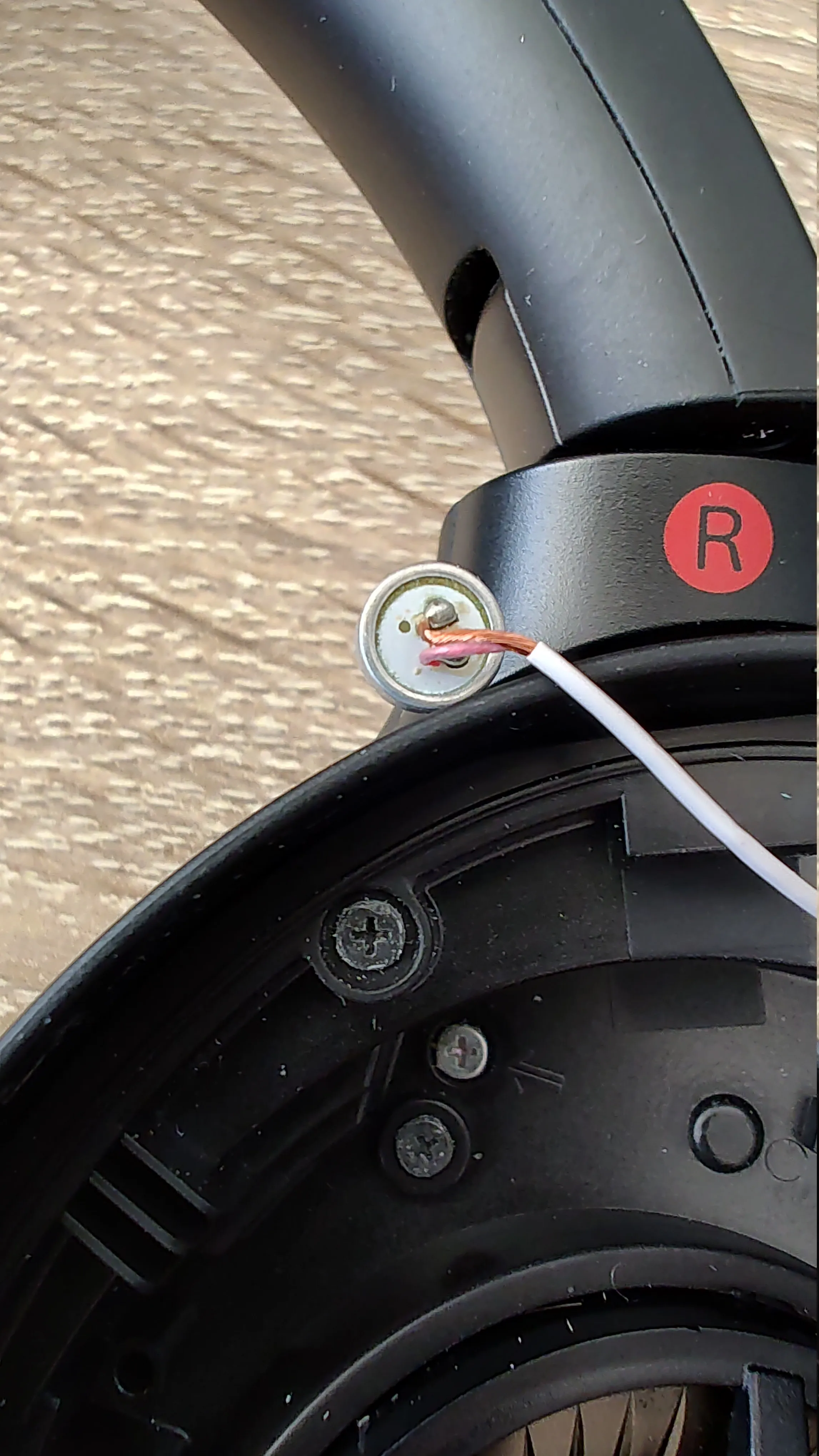 A resoldered ANC microphone on a Sony headphones